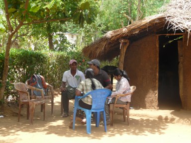 The lady of the house chats with us.